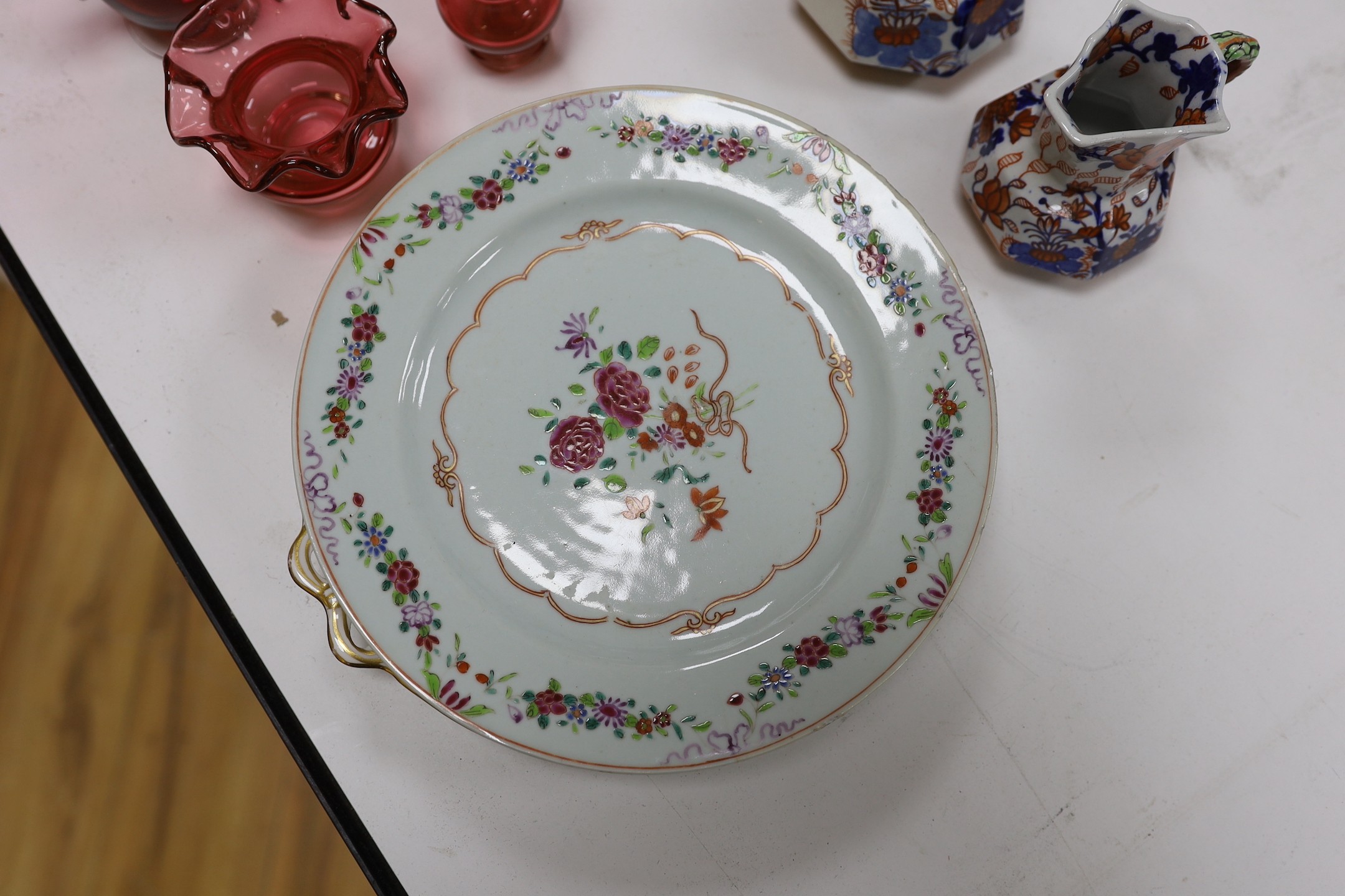 An assortment of cranberry glassware, graduated Masons Ironstone jugs, Chinese export plates etc.